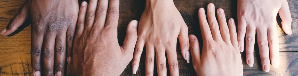 close up image of 5 hands in a row