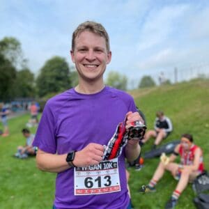 Tim Millbank from our Wigan Team holding a medal after completing the Wigan 10K run