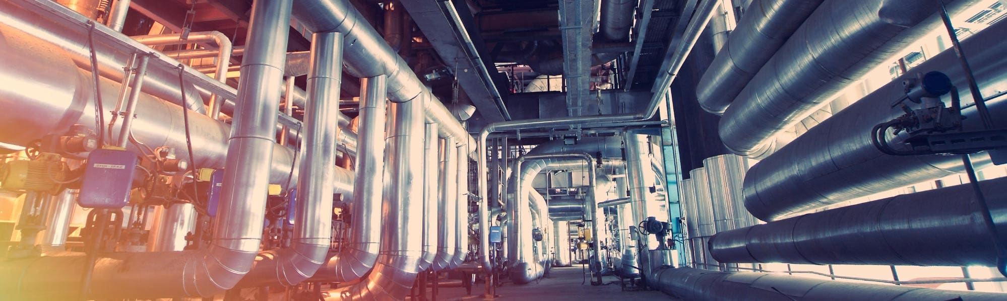 Image of large steel pipework in a factory