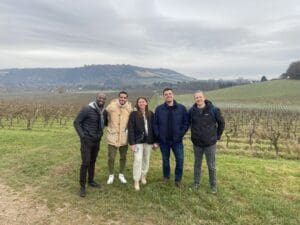 The Woking team walking the North Downs Way to raise money for charity, with fields in the distance.