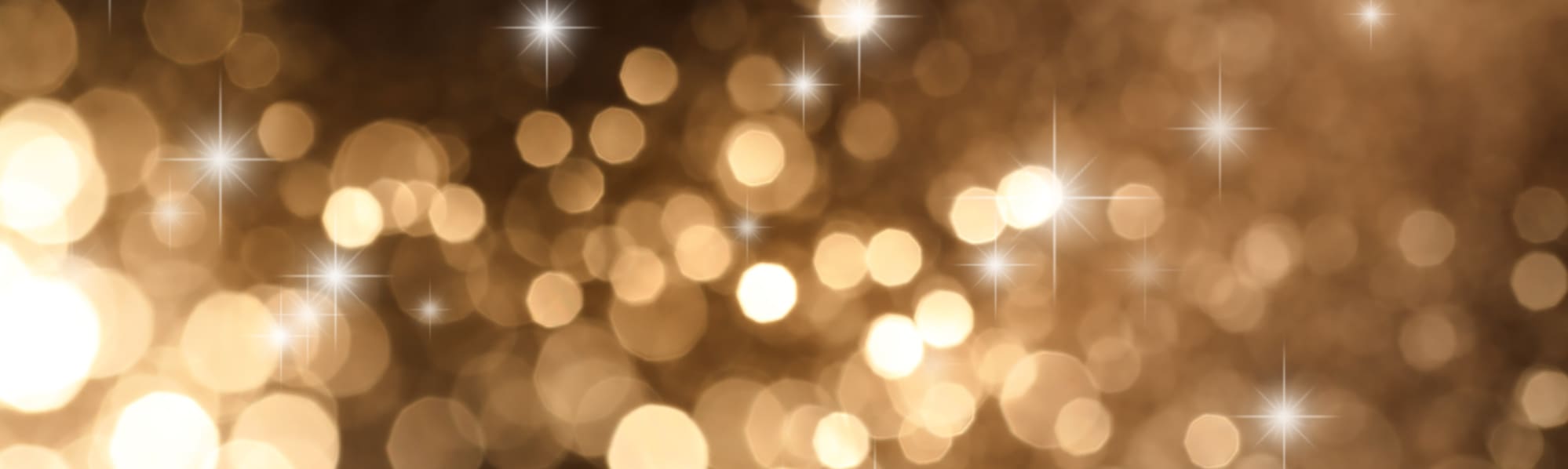 Black and gold glittery background with a sparkling effect.