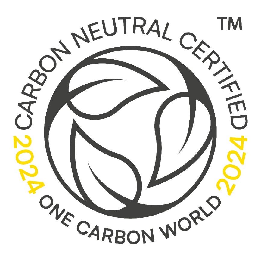 Badge reading Carbon Neutral Certified 2024 One Carbon World with circular leaf design.
