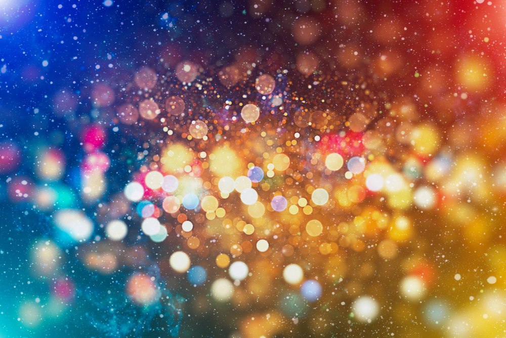 Blurred abstract lights in mixed colours, creating a soft glowing bokeh pattern.